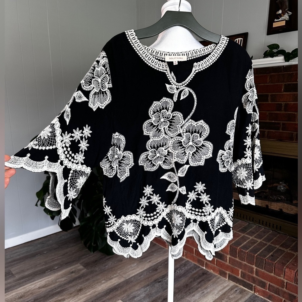 #7)  Solitaire Black with gorgeous white floral embroidered top Size medium.